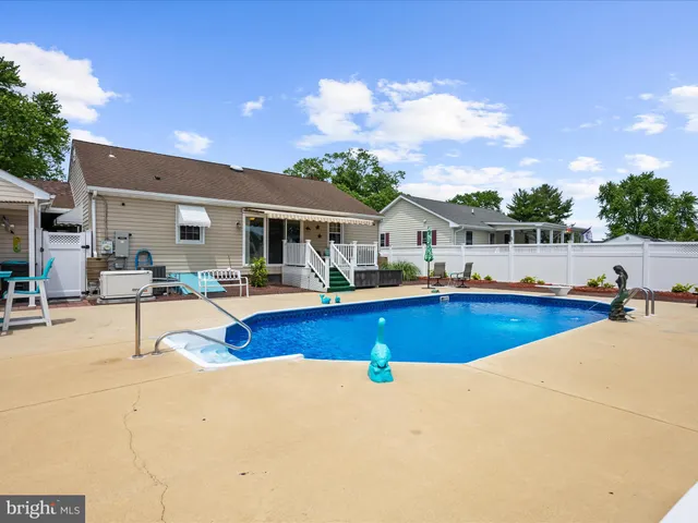 a view of swimming pool with outdoor seating