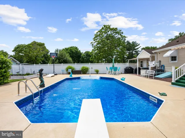 a view of a chairs and table in the patio