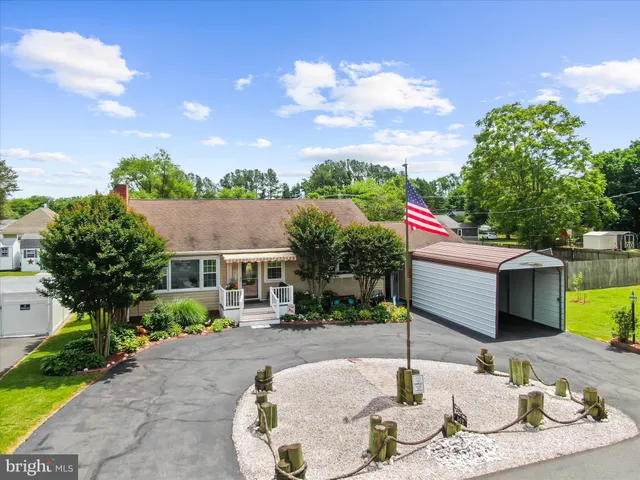 an aerial view of a house with swimming pool