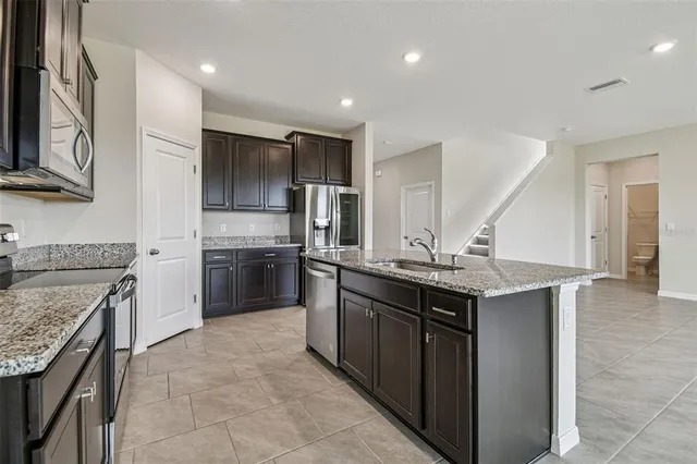 a kitchen with a sink and a bathtub
