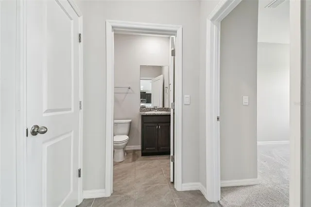 a bathroom with a shower and a toilet