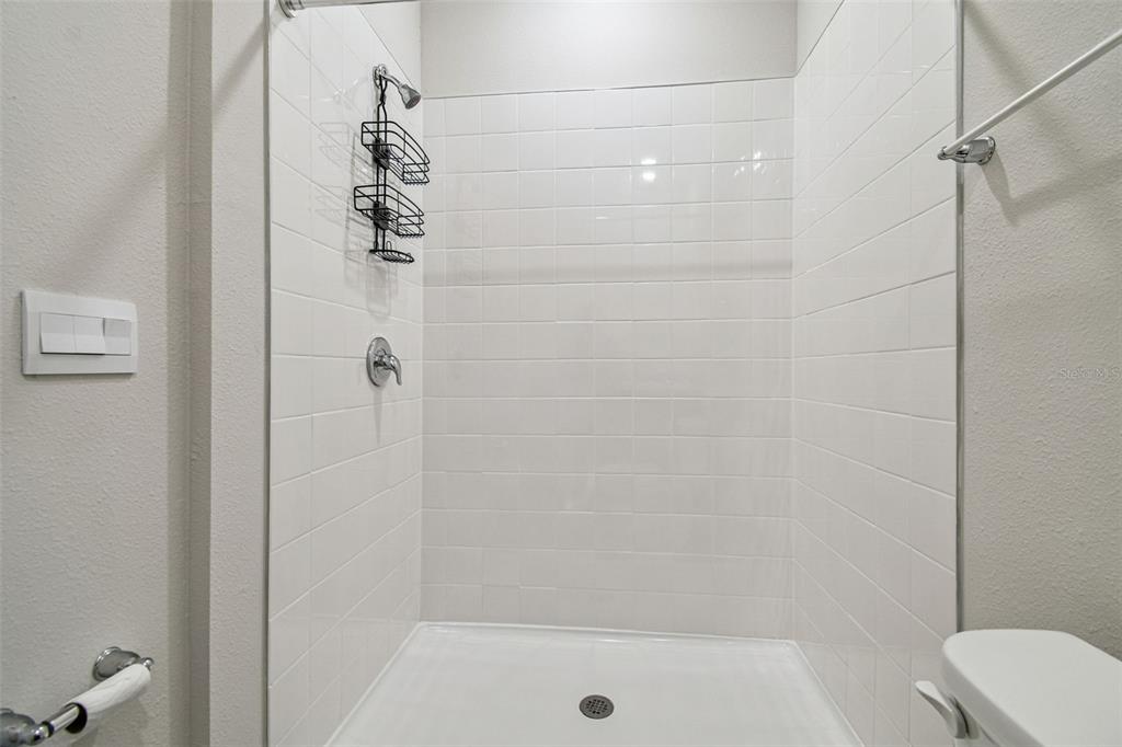 3827 Sunny Spring Street Plant City, FL 33565 - Photo 19 of 57 a bathroom with a shower and a toilet