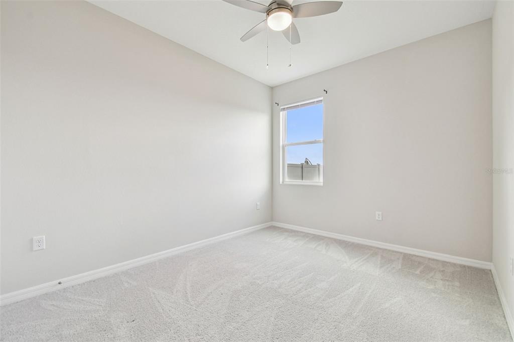 3827 Sunny Spring Street Plant City, FL 33565 - Photo 20 of 57 an empty room with a window