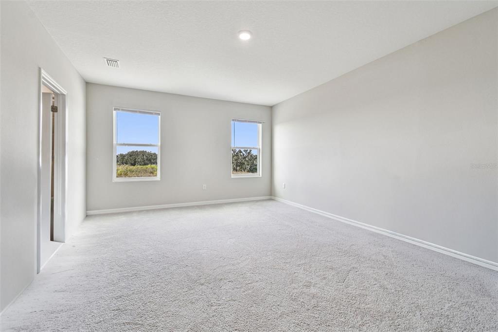 3827 Sunny Spring Street Plant City, FL 33565 - Photo 30 of 57 a view of an empty room with a window