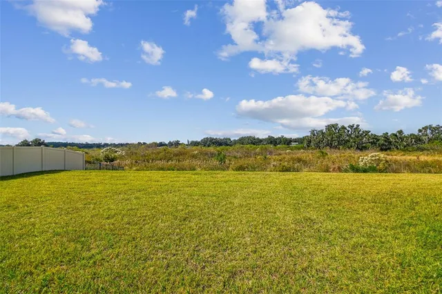 an aerial view of a swimming pool and outdoor space