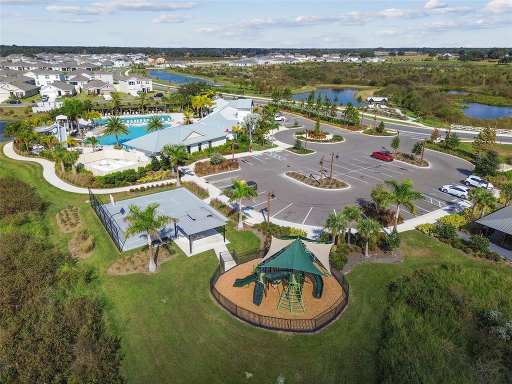 3827 Sunny Spring Street Plant City, FL 33565 - Photo 48 of 57 an aerial view of a house with a lake view