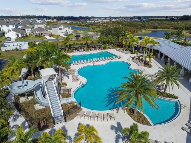 an aerial view of a house with a yard