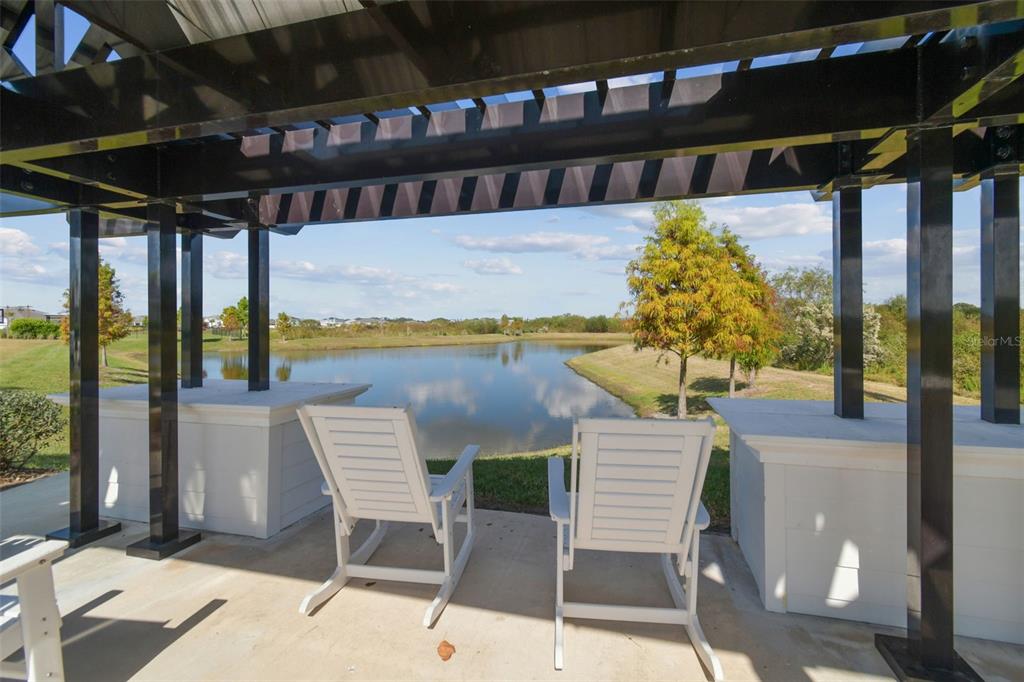 3827 Sunny Spring Street Plant City, FL 33565 - Photo 55 of 57 a view of a chairs and table in the patio