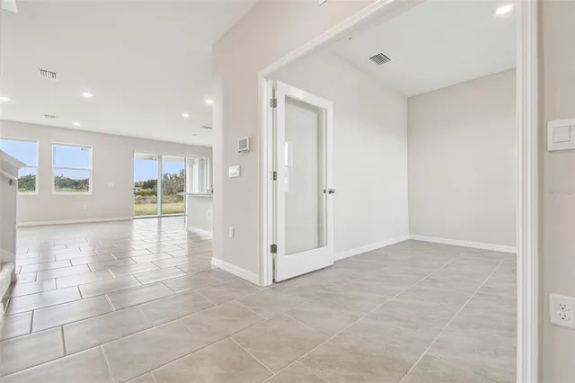 an empty room with closet area