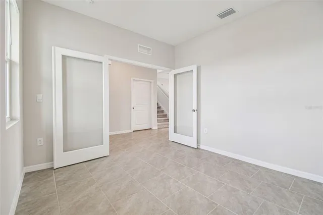 a view of an entryway with wooden floor and stairs