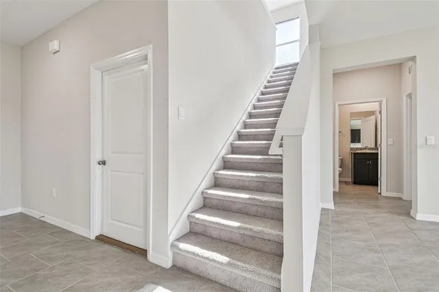 a kitchen with kitchen island granite countertop appliances cabinets and a sink