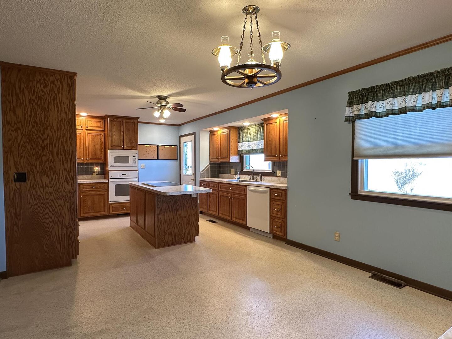 5317 North 1600th Street Newton, IL 62448 - Photo 11 of 63 a large kitchen with a lot of cabinets and stainless steel appliances