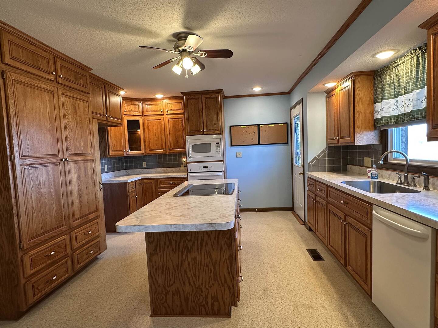 5317 North 1600th Street Newton, IL 62448 - Photo 12 of 63 a kitchen with kitchen island a counter top space appliances and cabinets