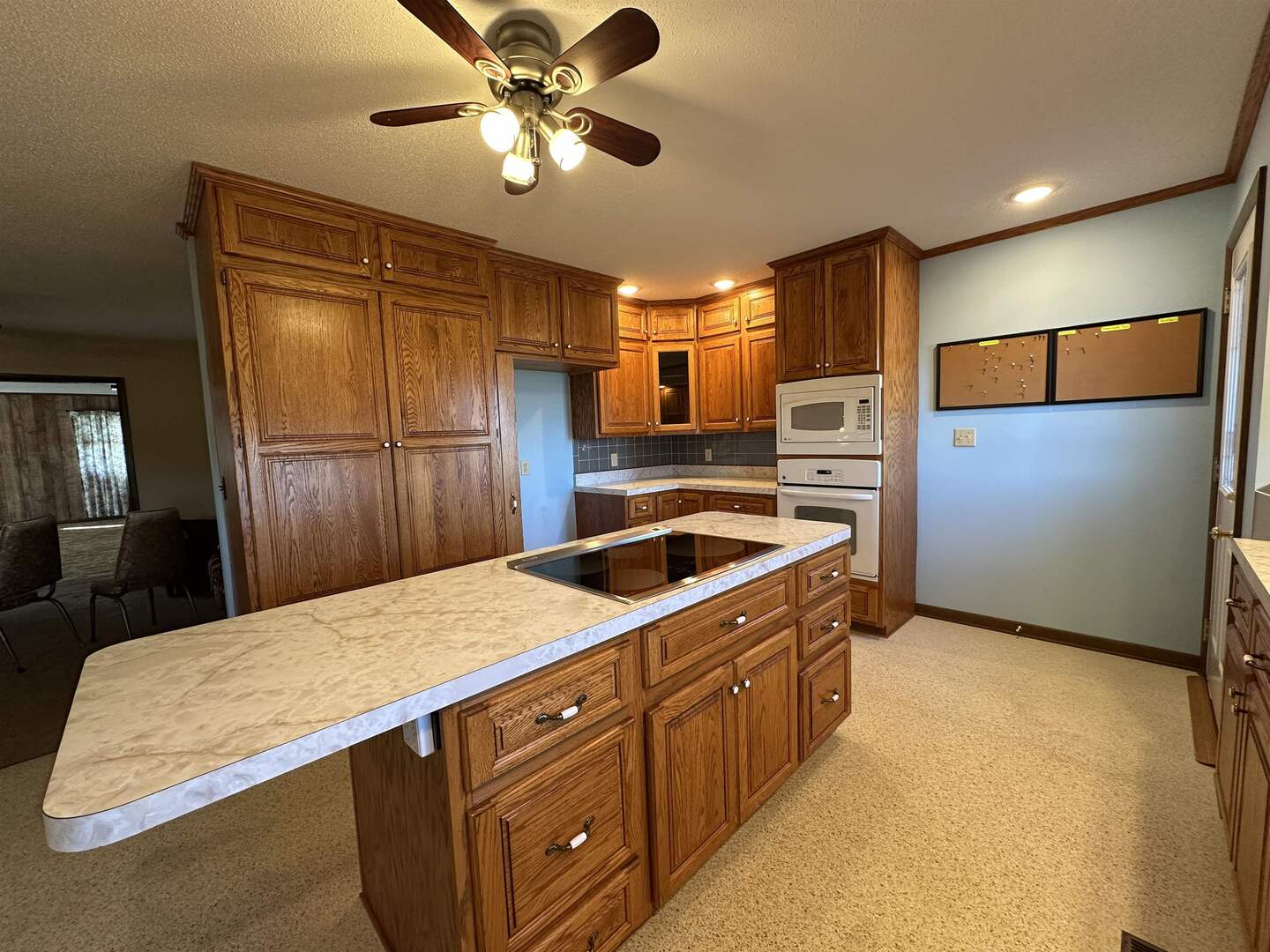 5317 North 1600th Street Newton, IL 62448 - Photo 13 of 63 a kitchen with stainless steel appliances granite countertop a refrigerator a sink a stove with wooden cabinets