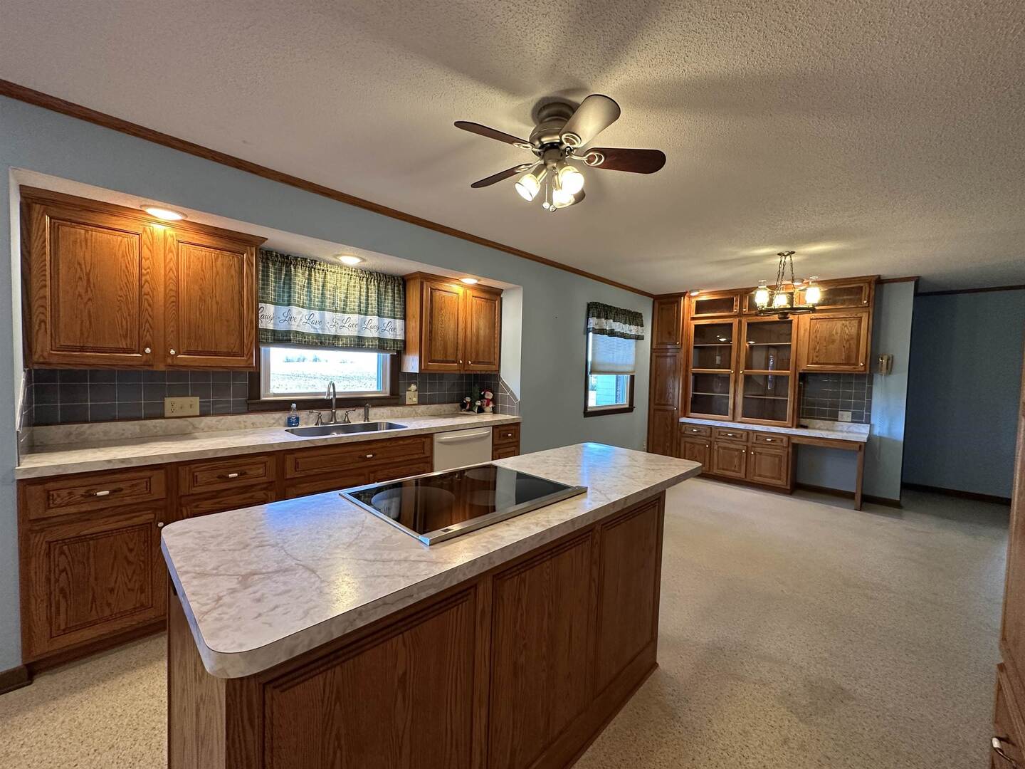 5317 North 1600th Street Newton, IL 62448 - Photo 14 of 63 a kitchen with a stove a sink and a refrigerator