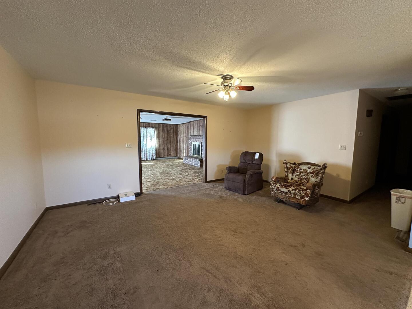 5317 North 1600th Street Newton, IL 62448 - Photo 16 of 63 a view of a livingroom with furniture and a ceiling fan
