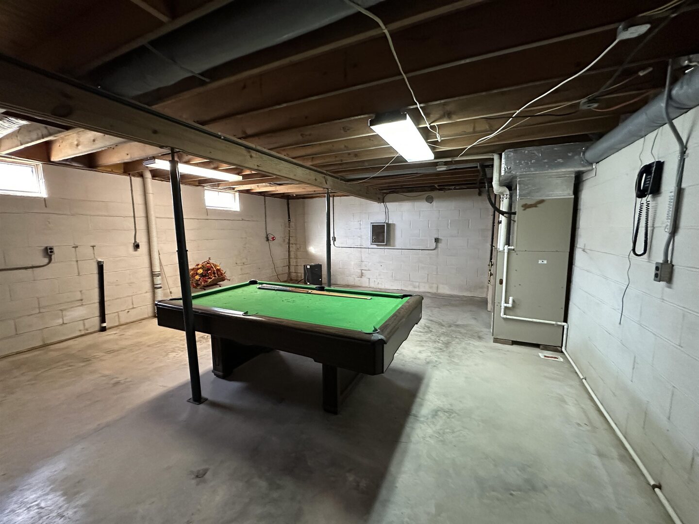 5317 North 1600th Street Newton, IL 62448 - Photo 29 of 63 a room with pool table windows and stairs