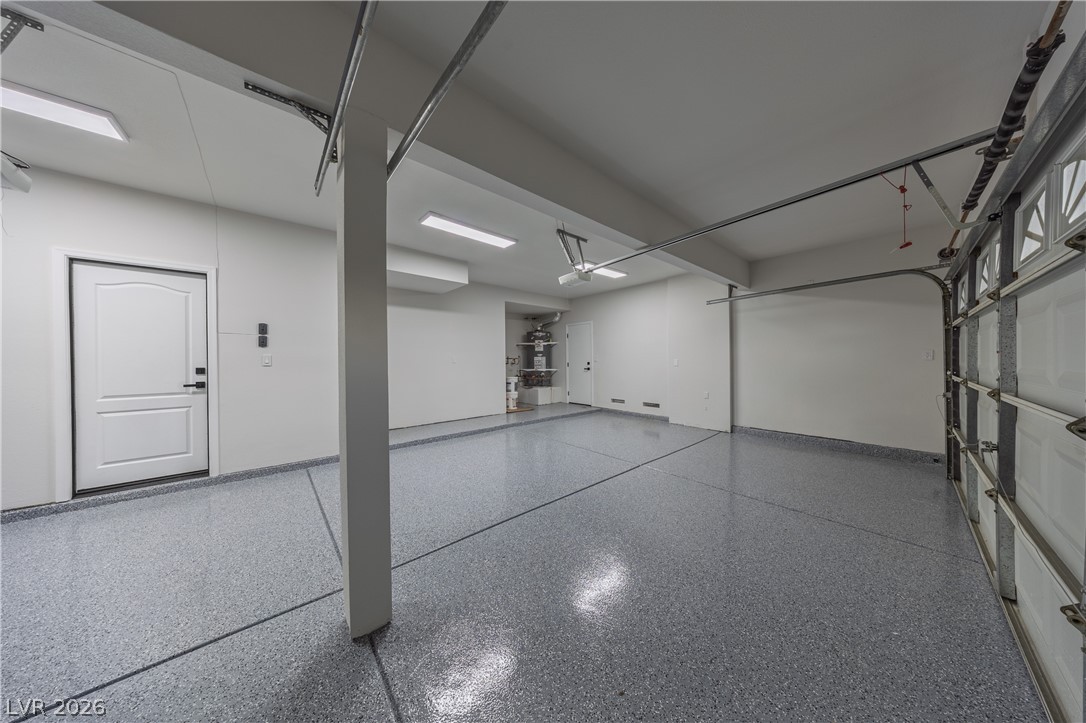 8800 Lusso Las Vegas, NV 89134 - Photo 84 of 85 Garage featuring ceiling fan and baseboards