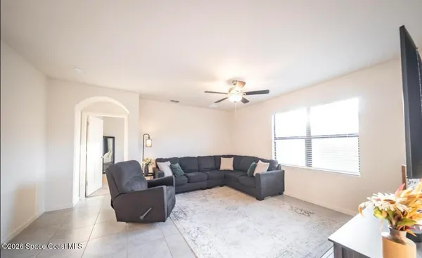 a living room with furniture and a window