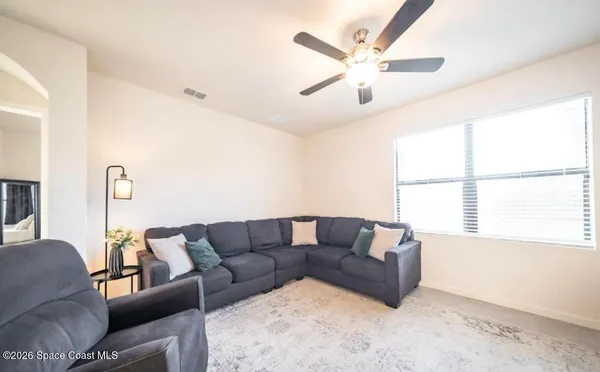 a living room with furniture and a window