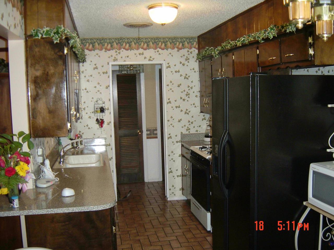 8131 Coronado Trail Amarillo, TX 79110 - Photo 3 of 12 a bathroom with a sink toilet and shower