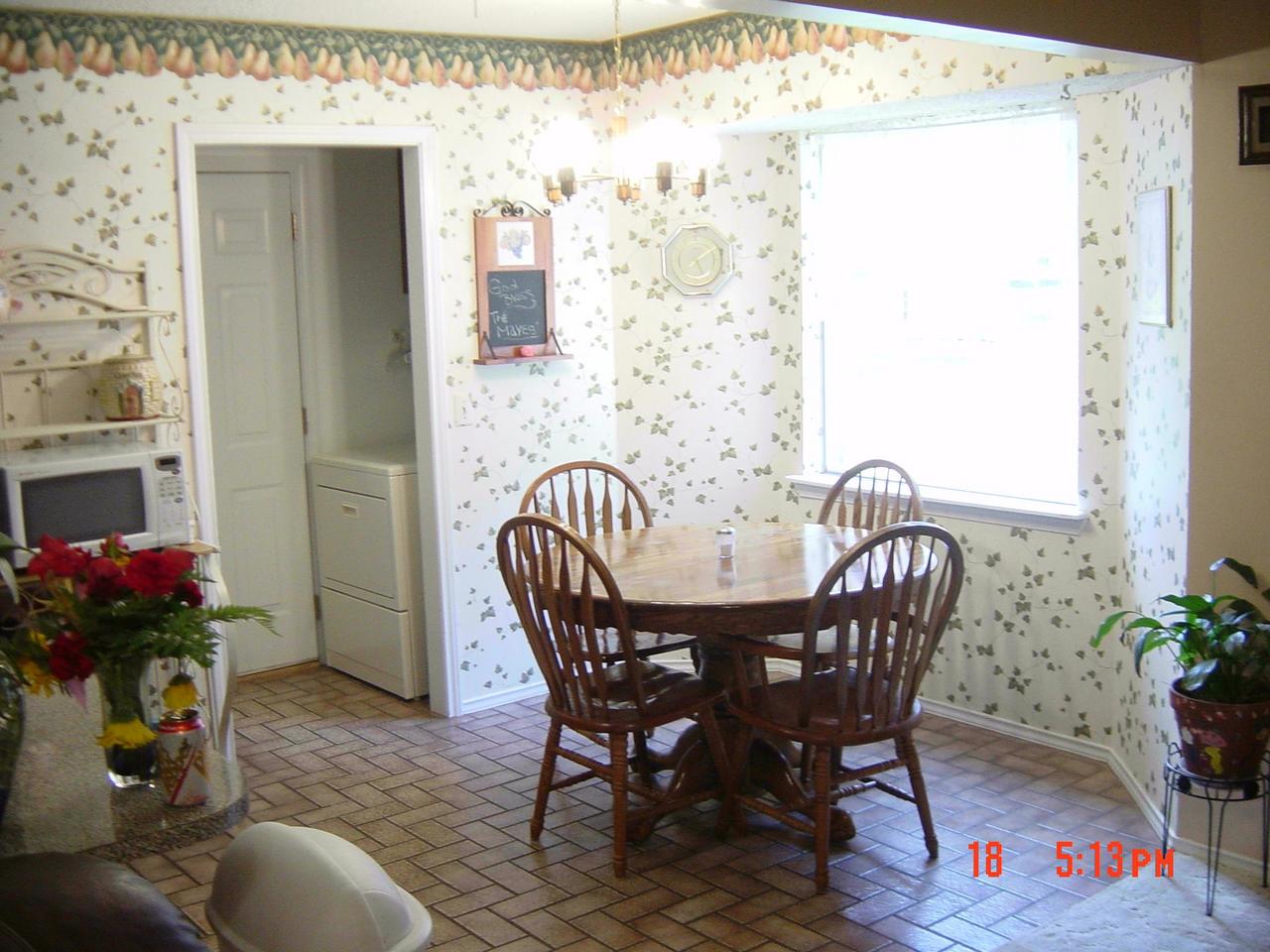 8131 Coronado Trail Amarillo, TX 79110 - Photo 4 of 12 a view of a dining room with furniture and a potted plant