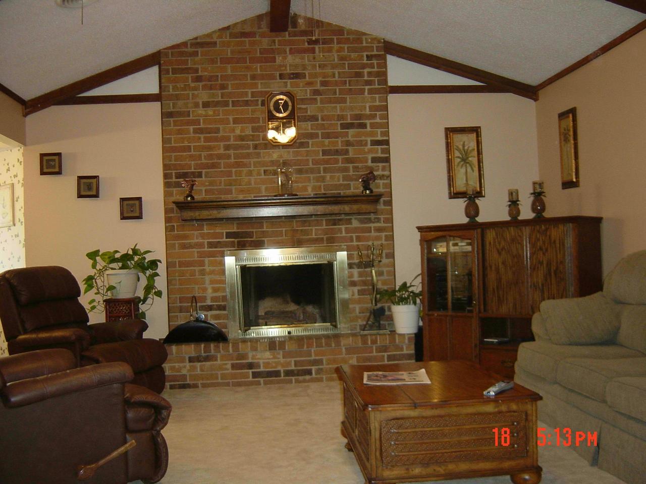 8131 Coronado Trail Amarillo, TX 79110 - Photo 8 of 12 a living room with furniture and a fireplace