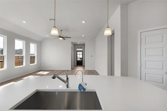a bathroom with a shower sink vanity and mirror