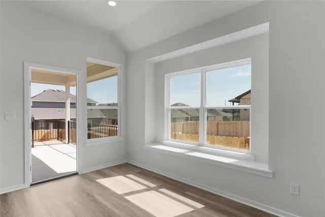 a bathroom with a sink toilet vanity and shower