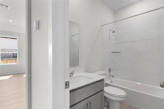 a view of a swimming pool with a patio and a garden