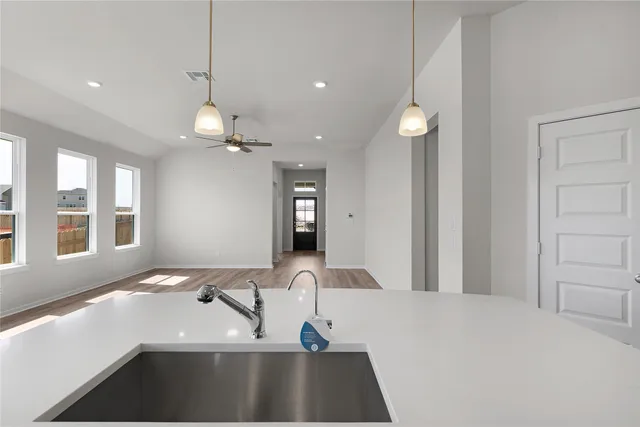a bathroom with a sink toilet vanity and shower