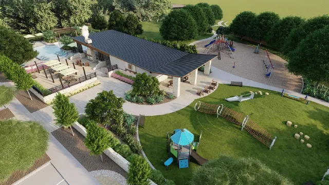 a front view of a house with a garden and plants