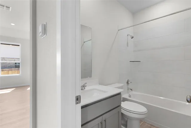 a view of a patio with couches table and chairs and potted plants