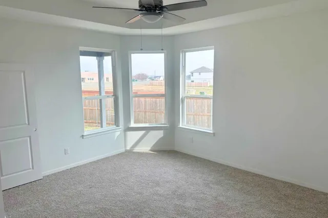 an empty room with wooden floor