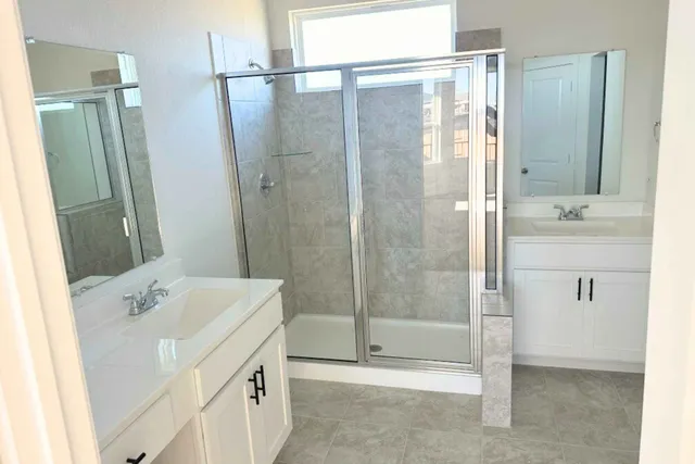 a kitchen with stainless steel appliances a refrigerator and a stove top oven