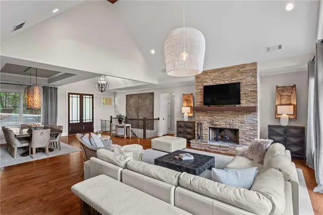a view of a dining room with furniture large windows and wooden floor