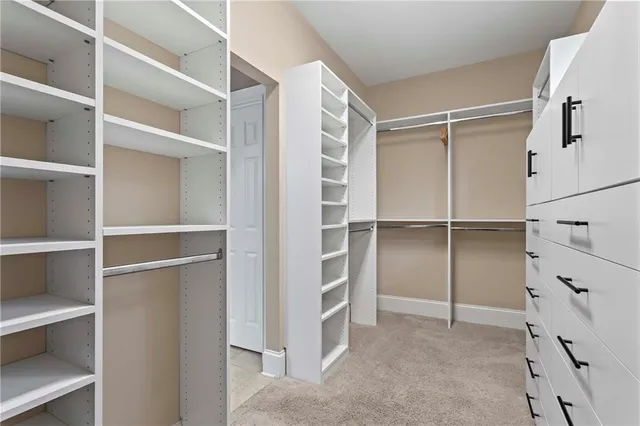 a view of a patio with furniture and garden