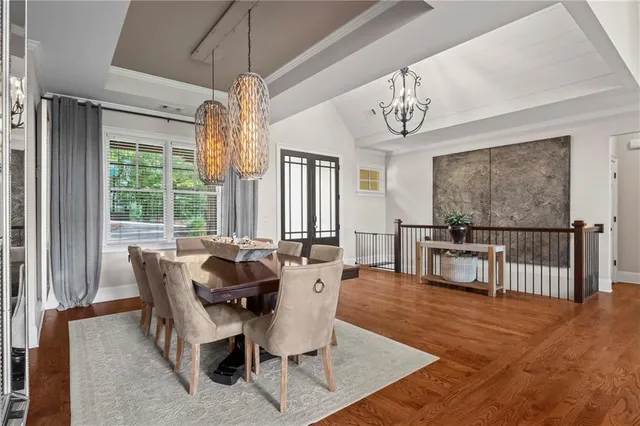 a living room with furniture fireplace and a large window
