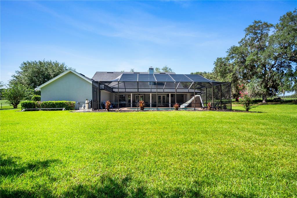 9045 Lake Hatchineha Road Kissimmee, FL 34759 - Photo 5 of 47 a front view of house with yard and green space