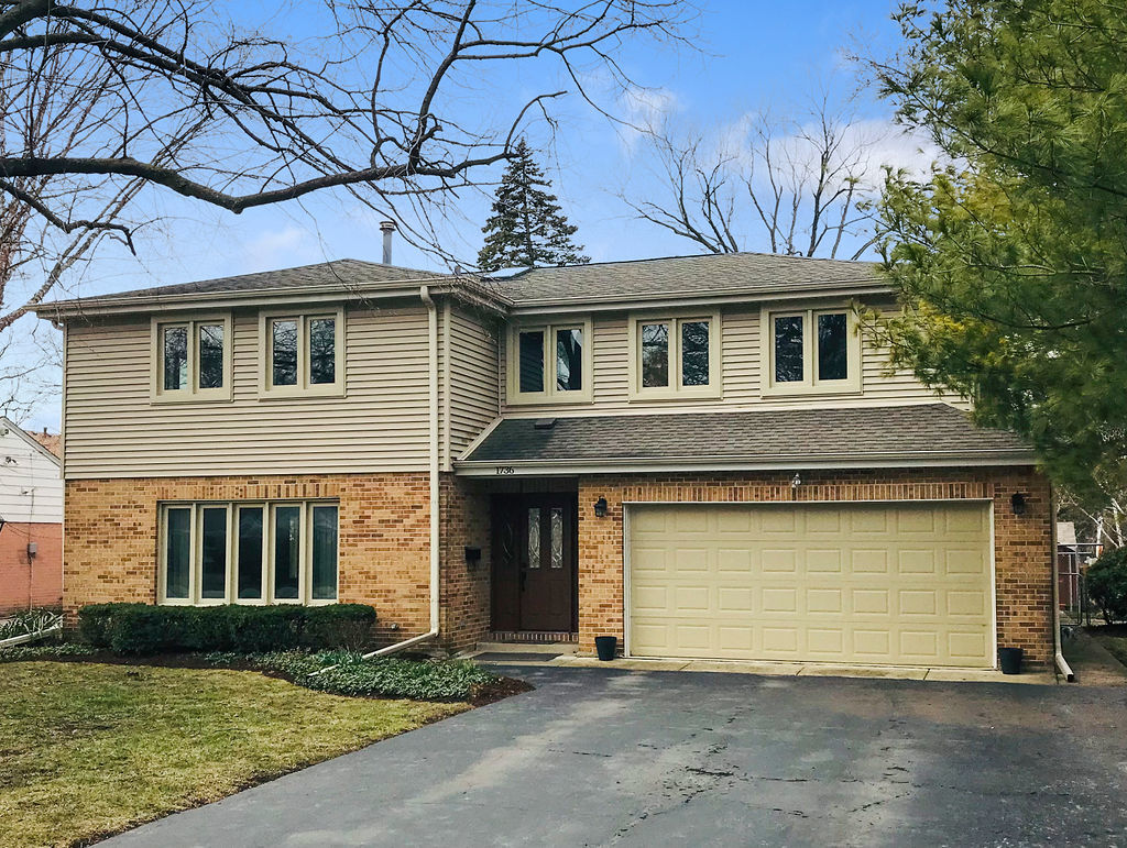 1736 Evergreen Lane Park Ridge, IL 60068 - Photo 1 of 37 a front view of a house with garden