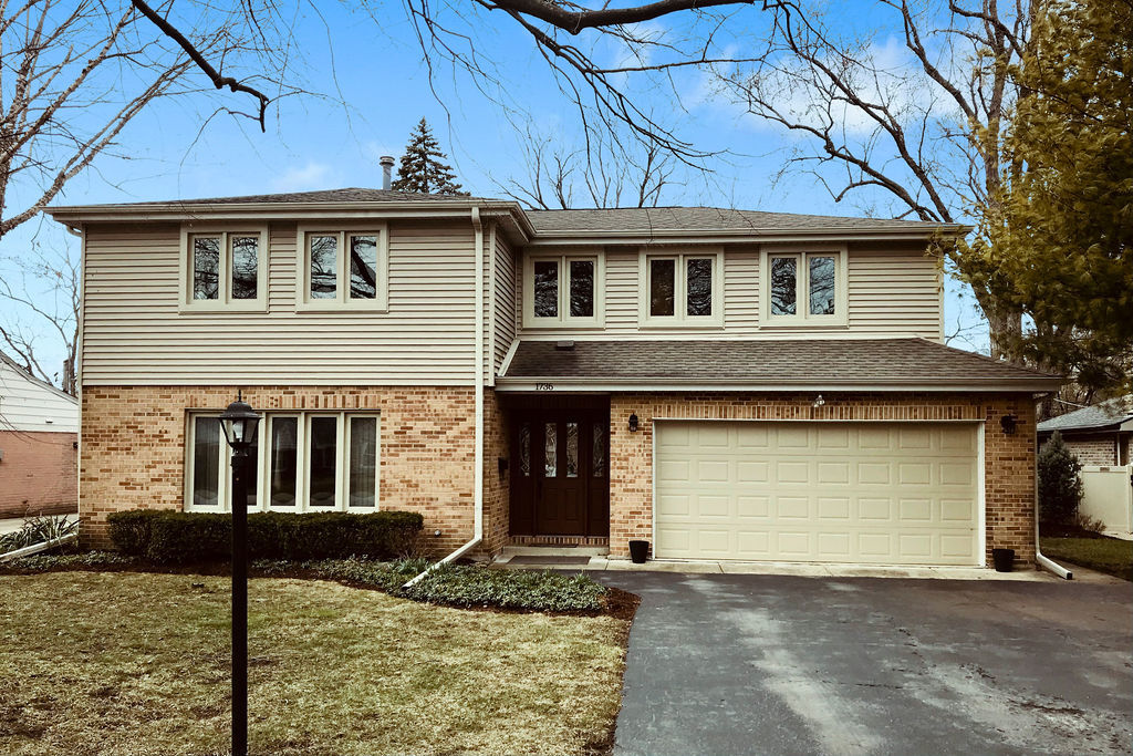 1736 Evergreen Lane Park Ridge, IL 60068 - Photo 2 of 37 a front view of a house with garden