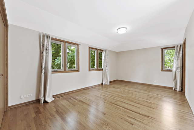 1736 Evergreen Lane Park Ridge, IL 60068 - Photo 21 of 37 an empty room with wooden floor and windows