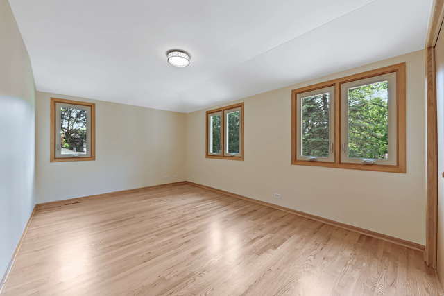 1736 Evergreen Lane Park Ridge, IL 60068 - Photo 26 of 37 a view of an empty room with wooden floor and a window