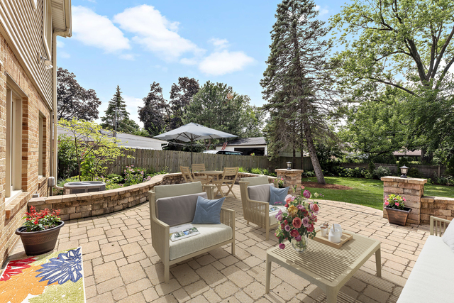1736 Evergreen Lane Park Ridge, IL 60068 - Photo 30 of 37 a view of swimming pool with outdoor seating and a garden