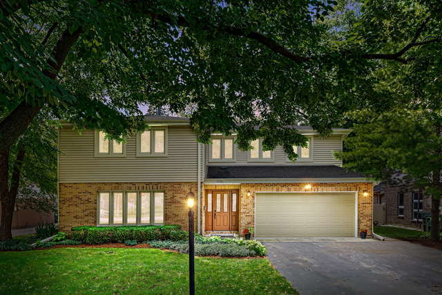 1736 Evergreen Lane Park Ridge, IL 60068 - Photo 3 of 37 a front view of a house with a yard and a garage