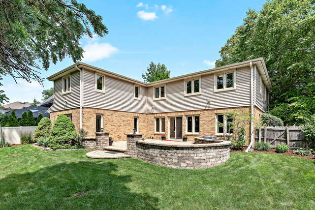 1736 Evergreen Lane Park Ridge, IL 60068 - Photo 33 of 37 a front view of a house with a yard table and chairs