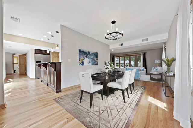1736 Evergreen Lane Park Ridge, IL 60068 - Photo 5 of 37 a view of a dining room with furniture and wooden floor