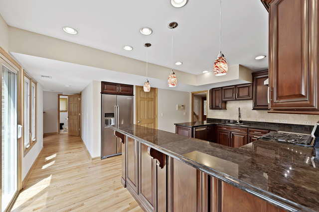 1736 Evergreen Lane Park Ridge, IL 60068 - Photo 9 of 37 a kitchen with granite countertop a sink and cabinets