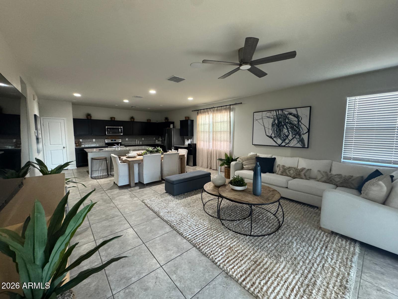 7851 West Riverside Avenue Phoenix, AZ 85043 - Photo 13 of 40 a living room with furniture kitchen view and a window