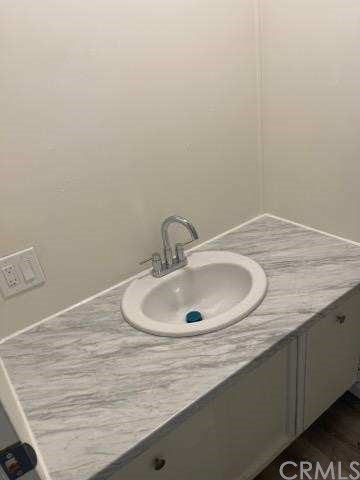 2345 190th, Unit 76 Redondo Beach, CA 90278 - Photo 10 of 10 a bathroom with a sink and a mirror